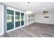 Bright living room with sliding glass doors to an outdoor patio with stylish floors at 566 Four Seasons Blvd, Summerville, SC 29486