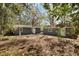 Home with backyard area, storage building, and mature trees at 5729 Edison Ave, Hanahan, SC 29410