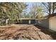 View of back yard with home and storage building at 5729 Edison Ave, Hanahan, SC 29410