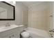 Well-lit bathroom with a shower and tub combination, vanity, and toilet at 5729 Edison Ave, Hanahan, SC 29410
