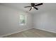 Bright bedroom features a ceiling fan and window offering natural light at 5729 Edison Ave, Hanahan, SC 29410