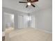 This bedroom features tiled floor, a ceiling fan, and two closets at 5729 Edison Ave, Hanahan, SC 29410