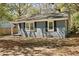 Side view of the home showing the foundation and the well manicured yard at 5729 Edison Ave, Hanahan, SC 29410