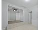 Spacious living room with stylish gray flooring and a ceiling fan at 5729 Edison Ave, Hanahan, SC 29410