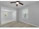 Bright living room features gray floors, a fan, and plenty of natural light at 5729 Edison Ave, Hanahan, SC 29410