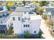 An aerial view of a modern home featuring a rooftop deck with string lights and outdoor seating at 7 Fields Pl, Charleston, SC 29403