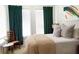 Bedroom with bright windows, stylish décor, comfortable bedding, and view of an abstract art piece at 7 Fields Pl, Charleston, SC 29403