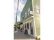 Commercial building exterior with a 'Wine' sign, promoting its business and location on a sidewalk at 7 Fields Pl, Charleston, SC 29403