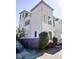 A view of a three-story home showcasing its architectural details and established landscaping at 7 Fields Pl, Charleston, SC 29403