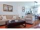 Inviting living area with comfortable seating, stylish decor, and an open layout to the kitchen at 7 Fields Pl, Charleston, SC 29403