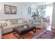 Open-concept living area with hardwood floors, modern furniture, and a kitchen with a breakfast bar at 7 Fields Pl, Charleston, SC 29403