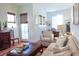 Cozy living room with hardwood floors, comfortable seating, and elegant décor with easy access to outdoor space at 7 Fields Pl, Charleston, SC 29403