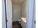 Bright bathroom with a shower-tub combo, modern vanity, toilet, and wood-look flooring at 719 Pisces Ln, Summerville, SC 29486