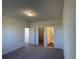 Bedroom featuring carpet, a ceiling light, and doorways leading to other parts of the home at 719 Pisces Ln, Summerville, SC 29486