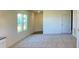 Bright living room with neutral paint, and large windows letting in plenty of natural light at 719 Pisces Ln, Summerville, SC 29486