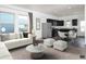 Bright and spacious living area with an adjacent open concept kitchen with dark cabinets at 719 Pisces Ln, Summerville, SC 29486