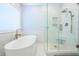 Elegant bathroom featuring soaking tub, marble tile shower, and modern fixtures at 772 Preservation Pl, Mount Pleasant, SC 29464