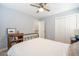 Bright bedroom featuring a metal bed frame, hardwood floor, closet, and a ceiling fan at 772 Preservation Pl, Mount Pleasant, SC 29464