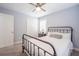 Bright bedroom with a metal bed frame, neutral tones, and a window for plenty of natural light at 772 Preservation Pl, Mount Pleasant, SC 29464