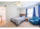 Inviting bedroom with an accent chair and windows providing natural light at 772 Preservation Pl, Mount Pleasant, SC 29464