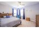 Comfortable bedroom featuring a ceiling fan, ample natural light, and cozy furnishings at 772 Preservation Pl, Mount Pleasant, SC 29464