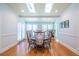 Light-filled dining room with skylights and a long wooden table set for a meal at 772 Preservation Pl, Mount Pleasant, SC 29464