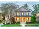 Beautiful two-story home with charming curb appeal, featuring a welcoming front porch and well-lit windows at 772 Preservation Pl, Mount Pleasant, SC 29464