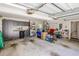 Spacious garage with built-in cabinets, storage racks, and ample room for vehicles and storage at 772 Preservation Pl, Mount Pleasant, SC 29464