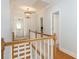 Upstairs hallway featuring hardwood floors, and access to bedrooms and bathrooms at 772 Preservation Pl, Mount Pleasant, SC 29464