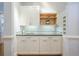 Stylish kitchen with white cabinets, granite countertops, a subway tile backsplash, and hardwood floors at 772 Preservation Pl, Mount Pleasant, SC 29464