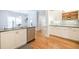 Bright and modern kitchen with stainless steel appliances, granite countertops, and hardwood floors at 772 Preservation Pl, Mount Pleasant, SC 29464