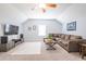 Comfortable living room featuring a large sectional sofa, TV, and neutral color palette at 772 Preservation Pl, Mount Pleasant, SC 29464