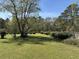 Beautifully kept lawn and landscaping in the spacious backyard at 7819 Bells Hwy, Ruffin, SC 29475