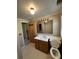 Modest bathroom with white vanity and toilet and neutral finishes at 7819 Bells Hwy, Ruffin, SC 29475