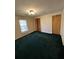 Neutral bedroom featuring a window, patterned walls, and closet with bifold doors at 7819 Bells Hwy, Ruffin, SC 29475