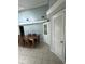 Dining area featuring beadboard walls, a large window, and modern tile flooring at 7819 Bells Hwy, Ruffin, SC 29475
