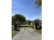 Gated driveway with a long approach to the home and garage on a sunny day at 7819 Bells Hwy, Ruffin, SC 29475