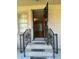 Inviting entryway with brick steps, decorative railing and view into the home at 7819 Bells Hwy, Ruffin, SC 29475