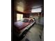 Spacious garage featuring a classic red and white pickup truck and ample storage at 7819 Bells Hwy, Ruffin, SC 29475