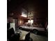 Spacious garage featuring a classic red and white pickup truck, lawnmower, and ample storage at 7819 Bells Hwy, Ruffin, SC 29475
