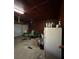 View of a garage with a green lawnmower parked inside with garage door at 7819 Bells Hwy, Ruffin, SC 29475