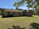 Brick house exterior, with a well-kept lawn and some mature tree coverage at 7819 Bells Hwy, Ruffin, SC 29475