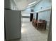 Bright kitchen and dining area with skylights, tile floors, and white cabinetry at 7819 Bells Hwy, Ruffin, SC 29475