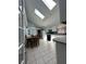 Inviting kitchen with skylights, white cabinets, tile floors and adjoining dining area at 7819 Bells Hwy, Ruffin, SC 29475