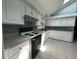Well-lit kitchen features white cabinetry, tile backsplash, modern appliances at 7819 Bells Hwy, Ruffin, SC 29475