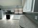 Bright kitchen featuring ample counter space, white cabinetry, and modern appliances at 7819 Bells Hwy, Ruffin, SC 29475