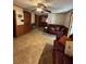 Inviting living room features wood paneling, ceiling fan, and comfortable seating at 7819 Bells Hwy, Ruffin, SC 29475