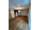 Cozy living room featuring hardwood floors, a modern chandelier, and neutral decor at 7819 Bells Hwy, Ruffin, SC 29475