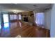Inviting living room features a stone fireplace, hardwood floors, and a stylish chandelier at 7819 Bells Hwy, Ruffin, SC 29475