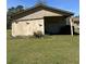 A side view of an outbuilding with a grassy yard and decorative birds at 7819 Bells Hwy, Ruffin, SC 29475